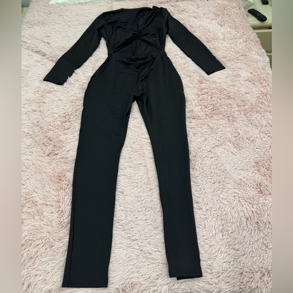 Sleek Black Jumpsuit with Plunging V-Neck and Long Sleeves